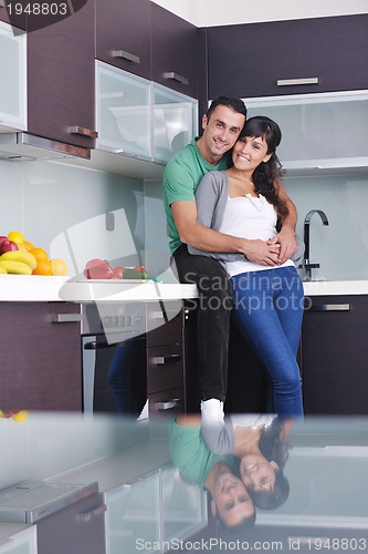 Image of young couple have fun in modern kitchen