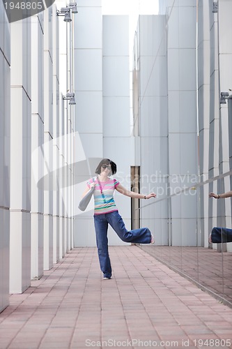 Image of beautiful young woman in the city
