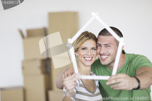 Image of Young couple moving in new home