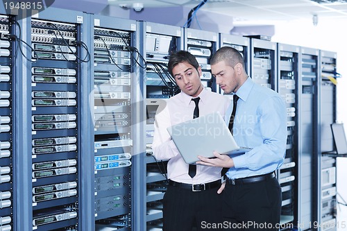 Image of it enineers in network server room