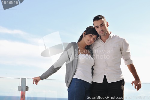 Image of couple relaxing on balcony