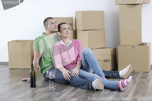 Image of Young couple moving in new home