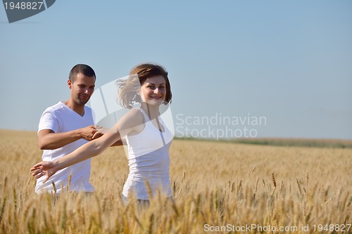 Image of happy couple in wheat field