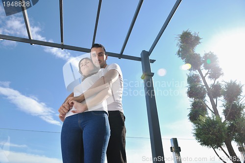 Image of couple relaxing on balcony