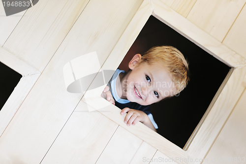 Image of happy child in a window