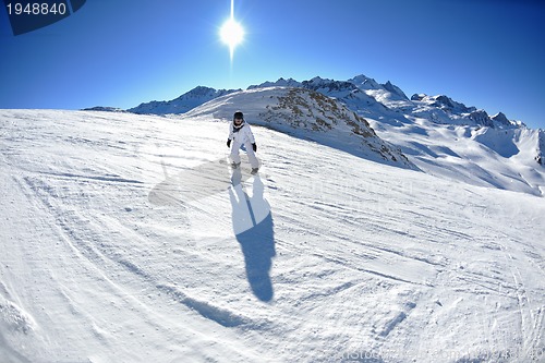 Image of skiing on fresh snow at winter season at beautiful sunny day