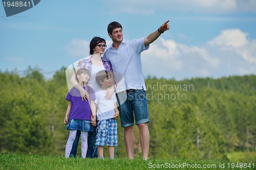 Image of happy young family have fun outdoors