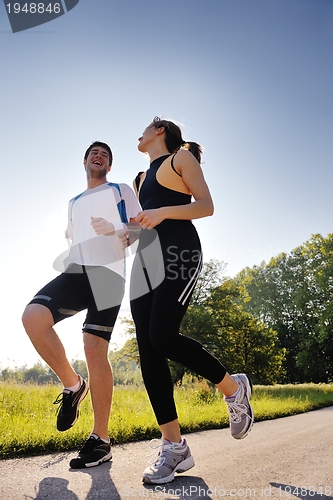 Image of Young couple jogging