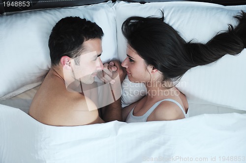 Image of young couple have good time in their bedroom