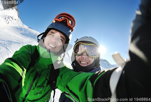 Image of winter portrait of friends at skiing