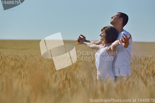 Image of happy couple in wheat field