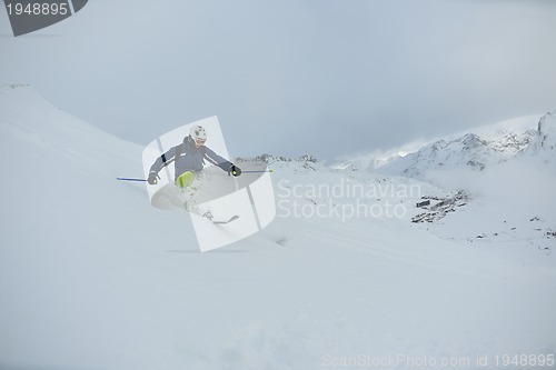 Image of skiing on fresh snow at winter season at beautiful sunny day