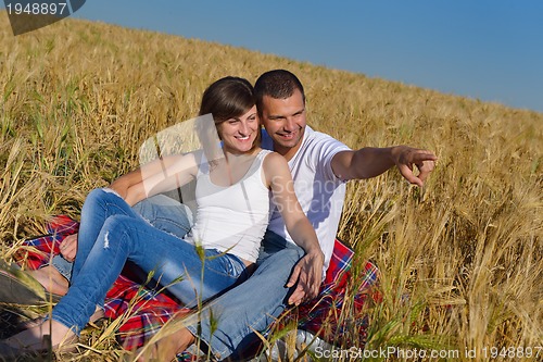 Image of happy couple in wheat field