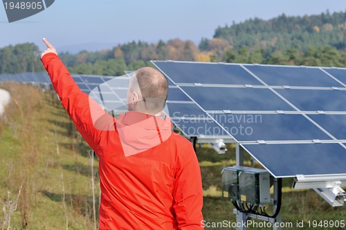 Image of Male solar panel engineer at work place