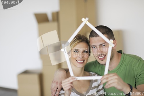 Image of Young couple moving in new home