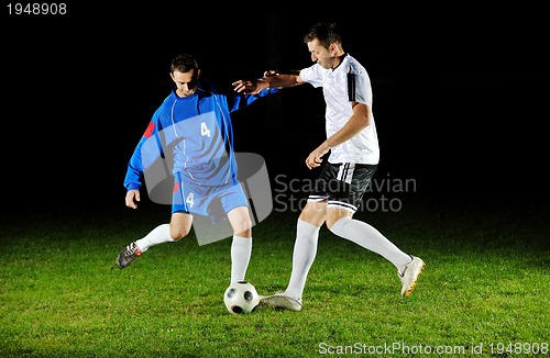 Image of football players in action for the ball