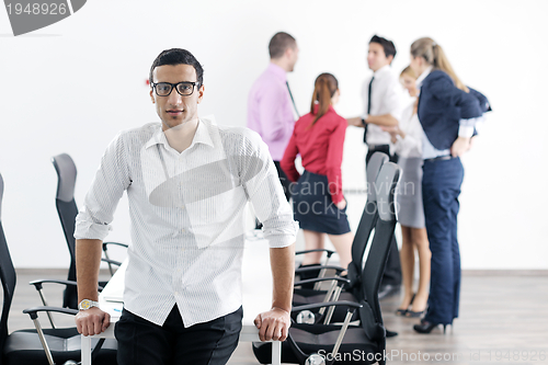 Image of young business man at meeting