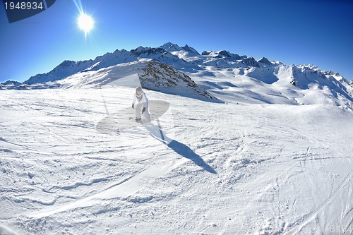 Image of skiing on fresh snow at winter season at beautiful sunny day