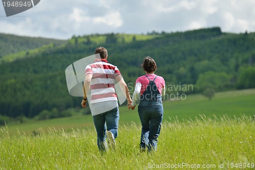 Image of romantic young couple in love together outdoor