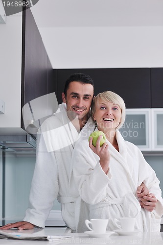 Image of young couple have fun in modern kitchen