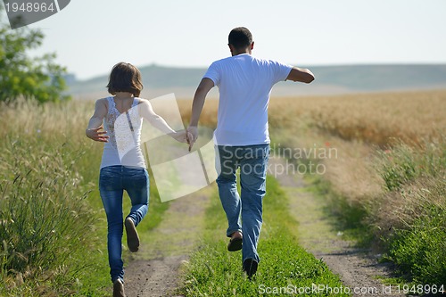 Image of happy couple in wheat field