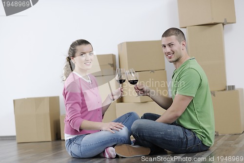 Image of Young couple moving in new home