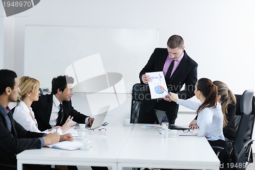 Image of Group of young business people at meeting