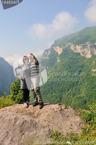 Image of happy young couple jumping in the air