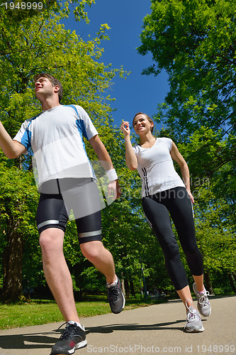 Image of Young couple jogging