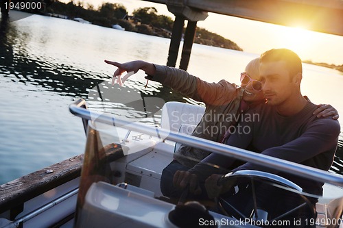 Image of couple in love  have romantic time on boat