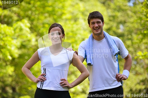 Image of Couple doing stretching exercise  after jogging