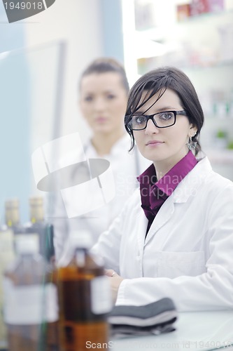 Image of team of pharmacist chemist woman  in pharmacy drugstore