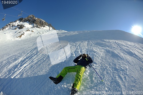 Image of skiing on fresh snow at winter season at beautiful sunny day