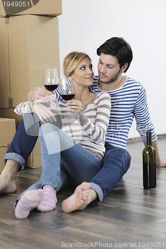Image of Young couple moving in new home
