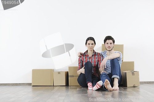 Image of Young couple moving in new home