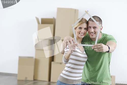 Image of Young couple moving in new home