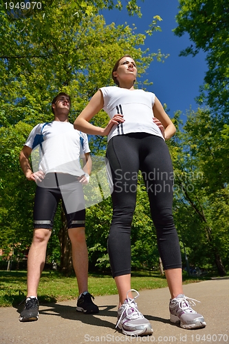 Image of Young couple jogging at morning