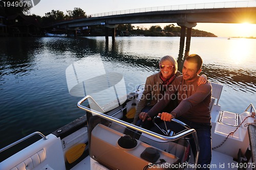 Image of couple in love  have romantic time on boat