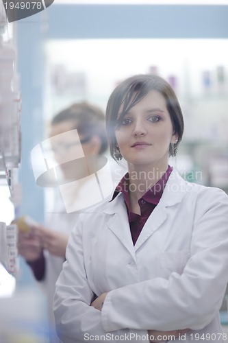 Image of team of pharmacist chemist woman  in pharmacy drugstore