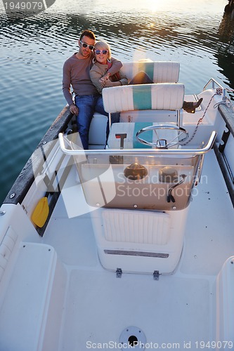 Image of couple in love  have romantic time on boat