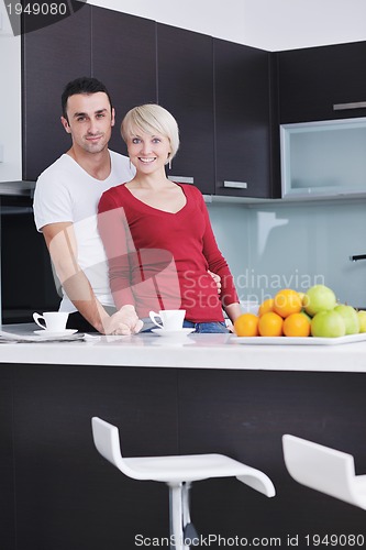 Image of young couple have fun in modern kitchen