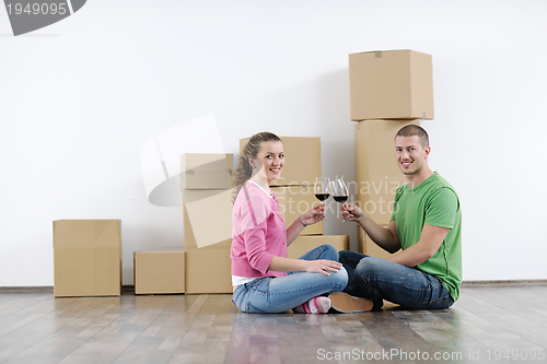 Image of Young couple moving in new house