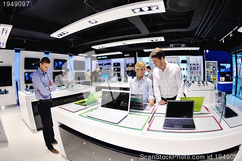 Image of people buy  in consumer electronics store