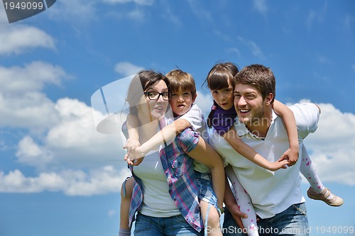 Image of happy young family have fun outdoors