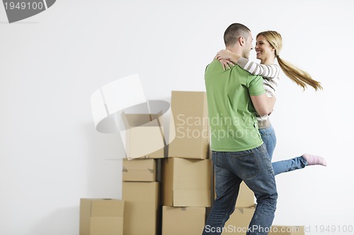 Image of Young couple moving in new home