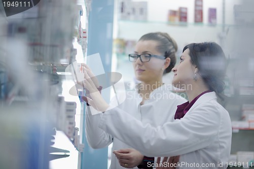 Image of team of pharmacist chemist woman  in pharmacy drugstore