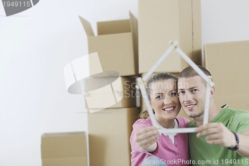 Image of Young couple moving in new home