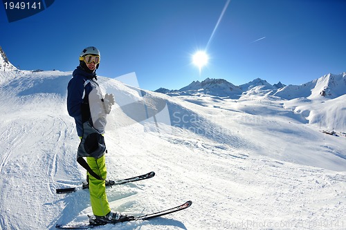 Image of skiing on fresh snow at winter season at beautiful sunny day