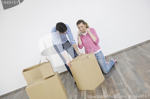 Image of Young couple moving in new home