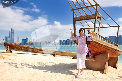 Image of happy tourist woman